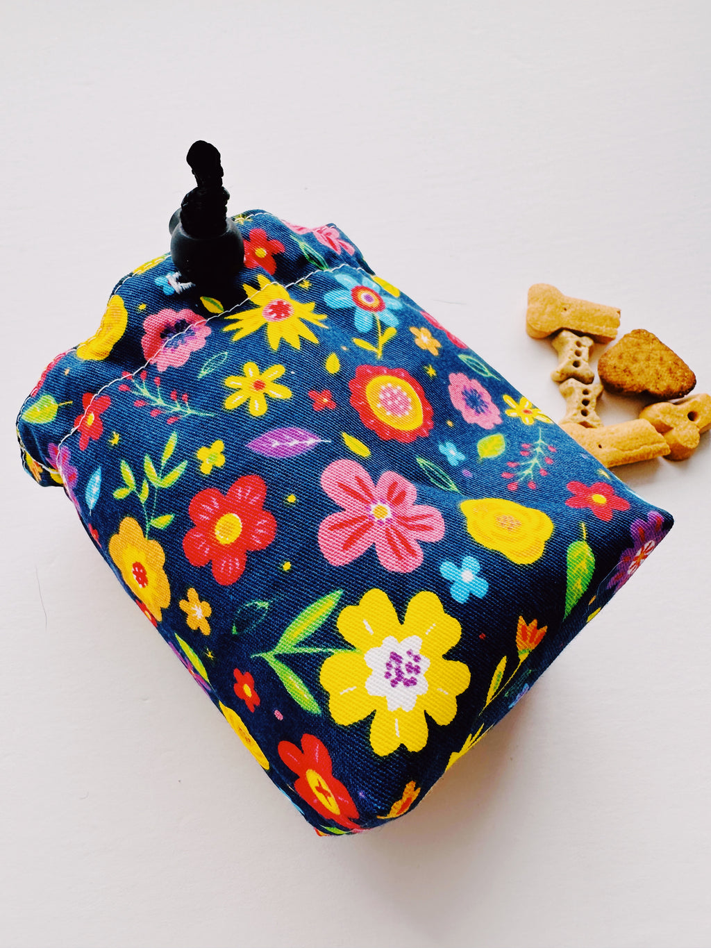Multicolor flower fabric creating a pouch 
