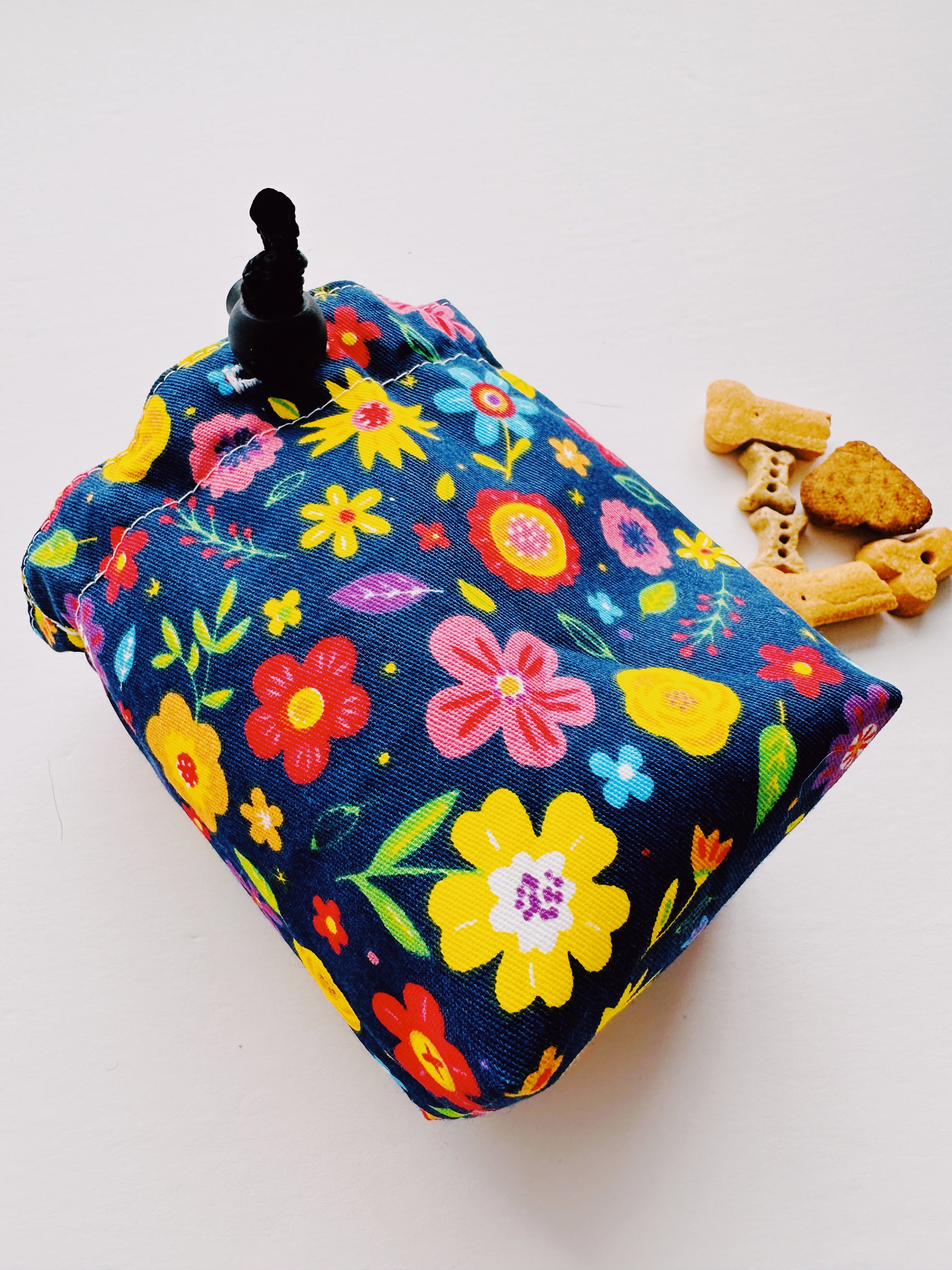 Multicolor flower fabric creating a pouch 

