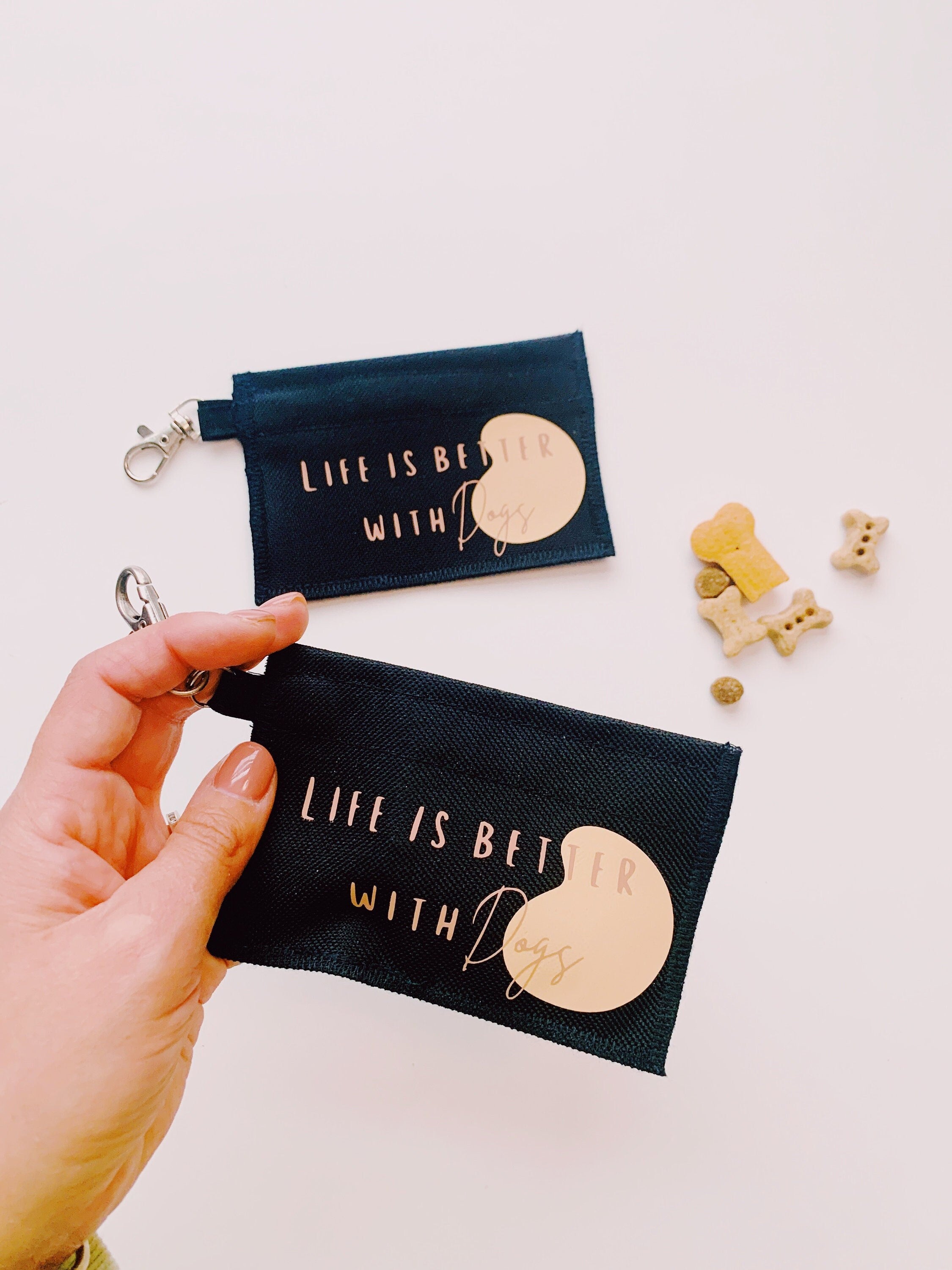 Clip on small treat pouch with velcro that reads life is better with dogs