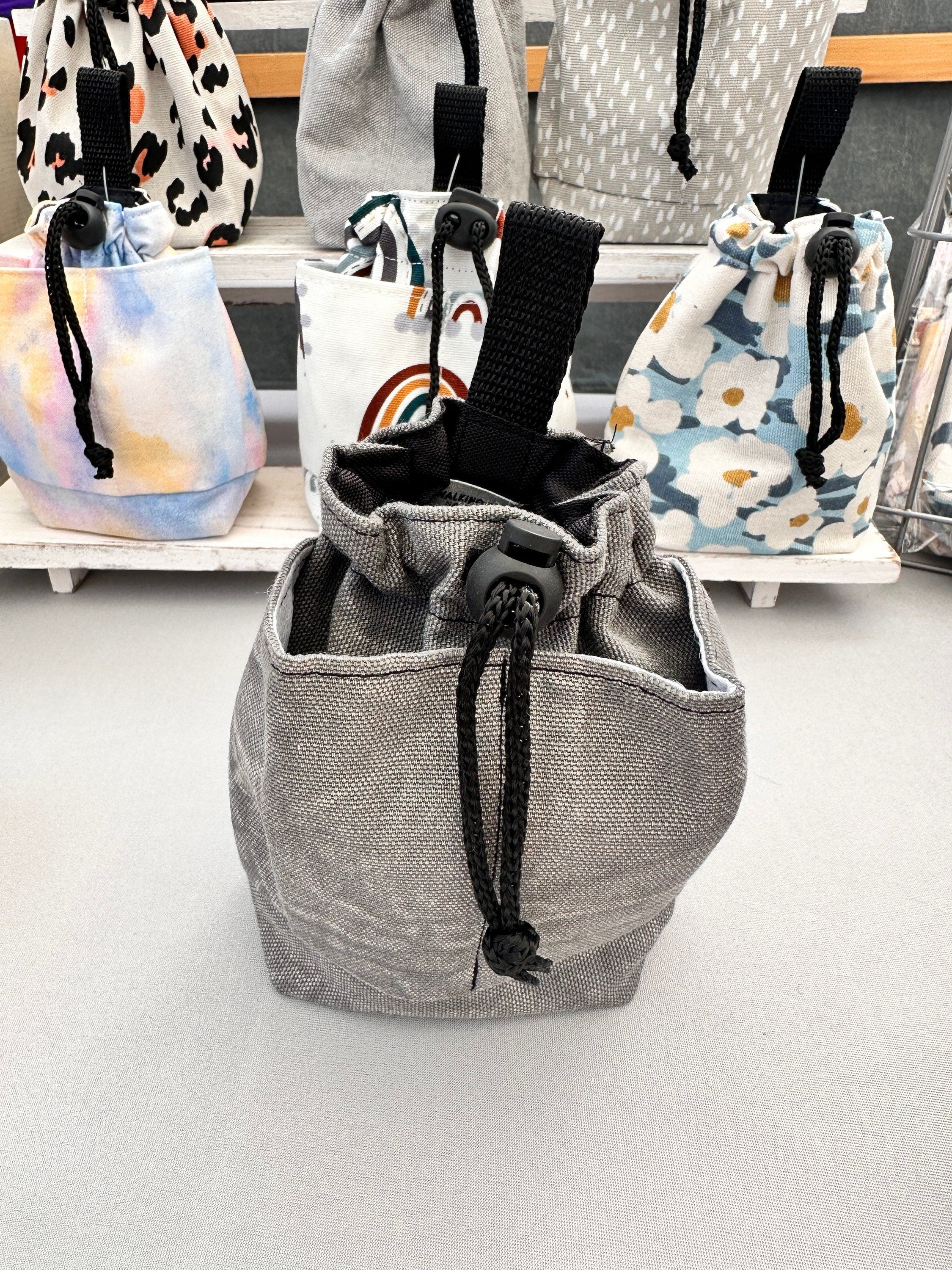 Black treat pouch holder with pockets 