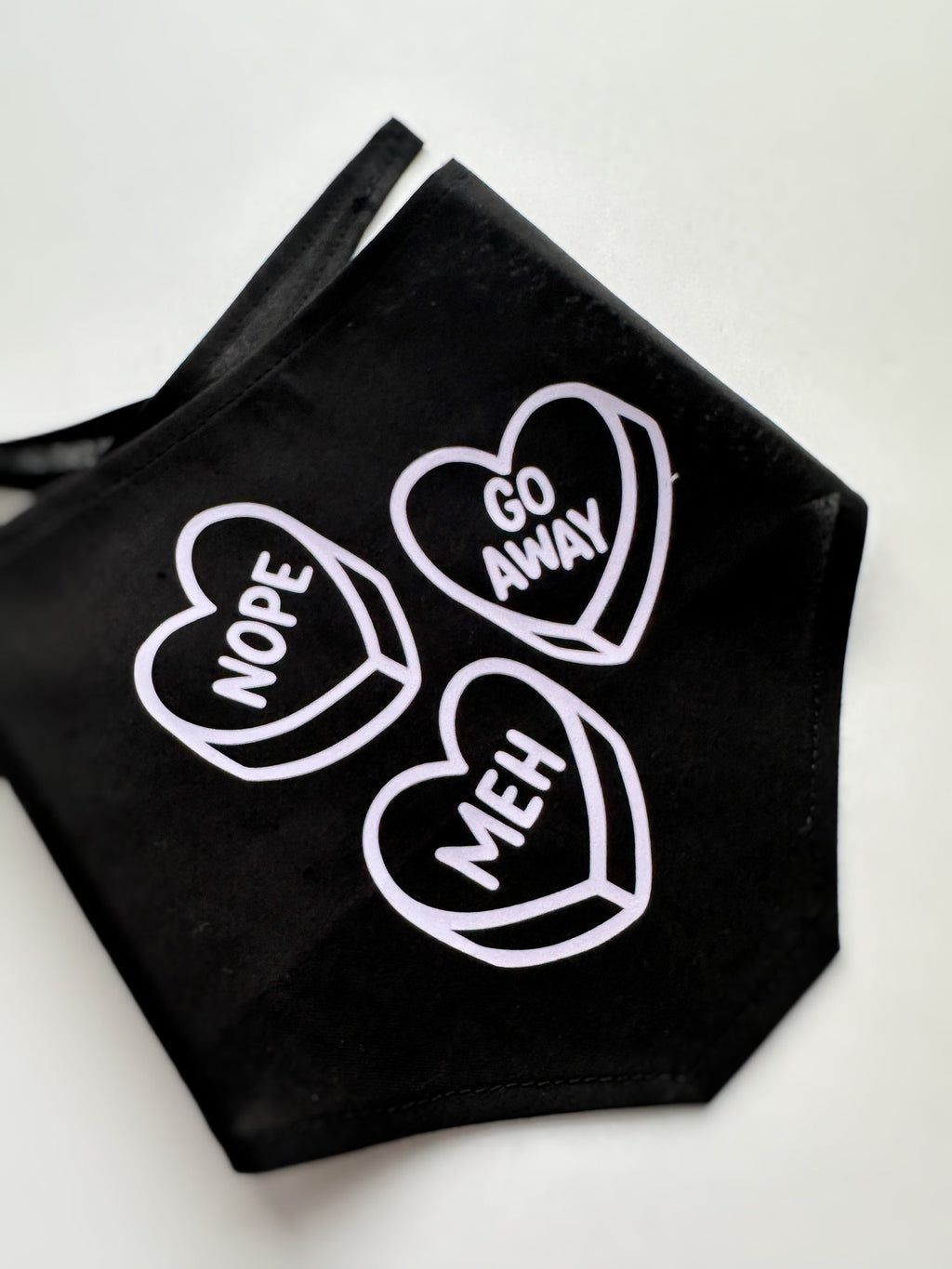 stylish anti-valentine pet bandana, perfect for both cats and dogs. meh, nope, go away lavender iron-on over black. Tie on triangular bandan