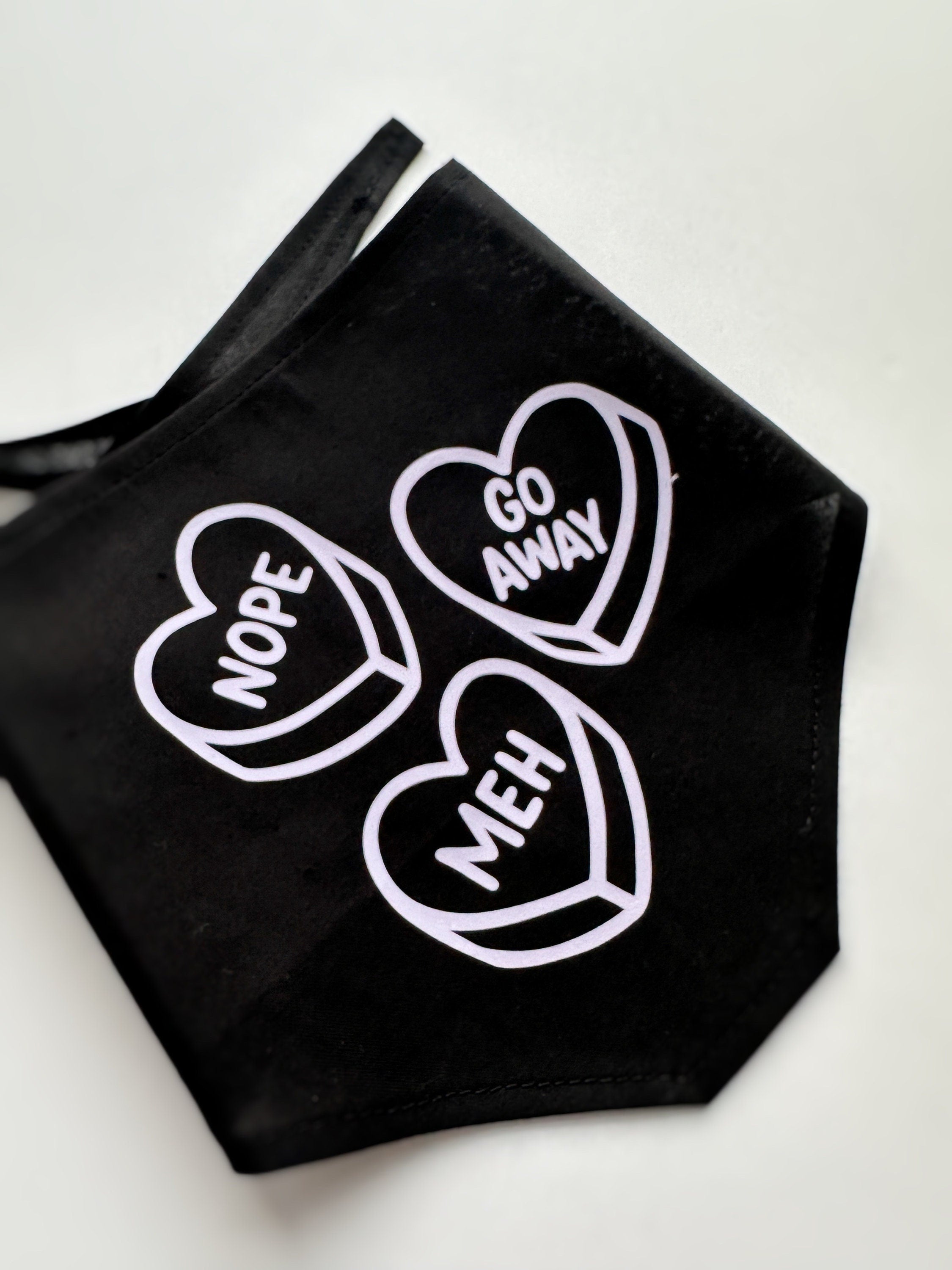 stylish anti-valentine pet bandana, perfect for both cats and dogs. meh, nope, go away lavender iron-on over black. Tie on triangular bandan